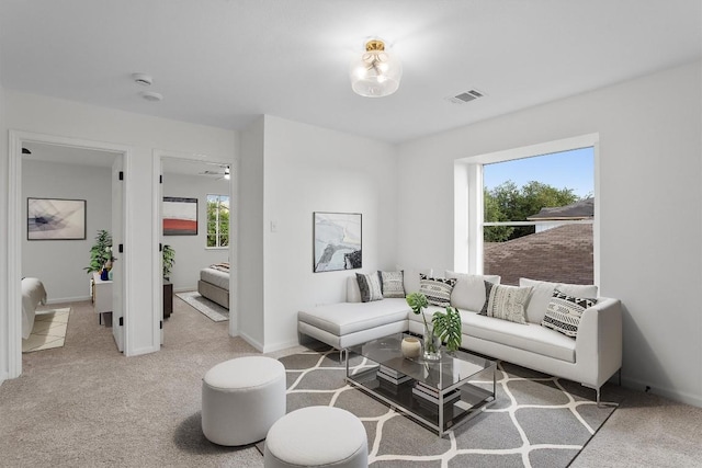 15532 Emmaleighs Ln, Pflugerville, TX 78660 - living area featuring plenty of natural light and light colored carpet