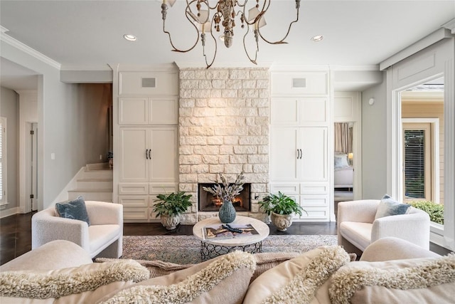 2115 W 11th St, Austin, TX 78703 - living area with ornamental molding, a chandelier, recessed lighting, a large fireplace, and dark wood finished floors