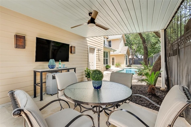 2115 W 11th St, Austin, TX 78703 - fenced backyard with outdoor dining area, a patio, and a ceiling fan