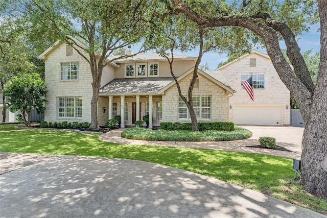 2115 W 11th St, Austin, TX 78703 - traditional-style house featuring stone siding, a garage, concrete driveway, a front lawn, and stucco siding