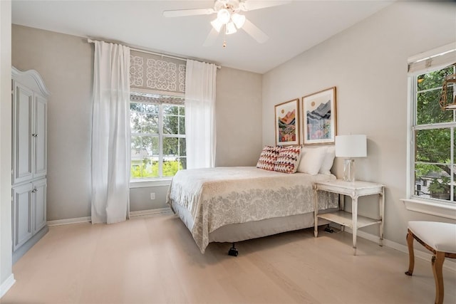 2115 W 11th St, Austin, TX 78703 - bedroom with baseboards and ceiling fan