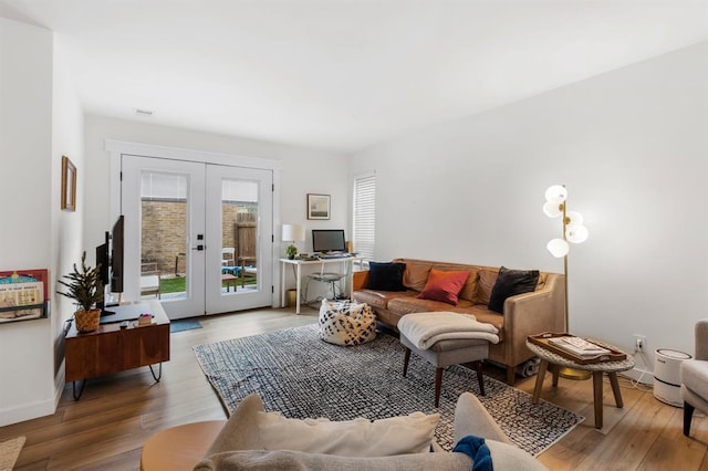 3431 N Hills Dr Unit 112, Austin, TX 78731 - living area featuring french doors and wood finished floors