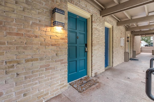 3431 N Hills Dr Unit 112, Austin, TX 78731 - doorway to property with brick siding
