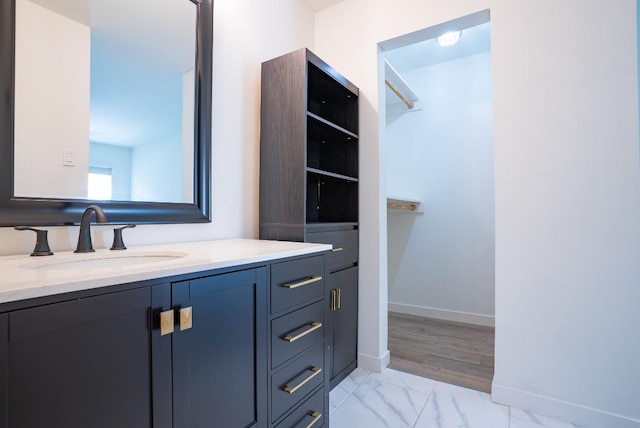 3431 N Hills Dr Unit 112, Austin, TX 78731 - bathroom with vanity and marble look tile flooring