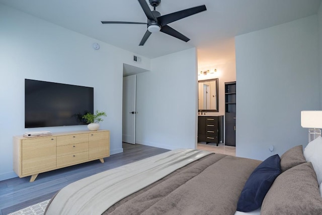 3431 N Hills Dr Unit 112, Austin, TX 78731 - bedroom with wood finished floors and a ceiling fan