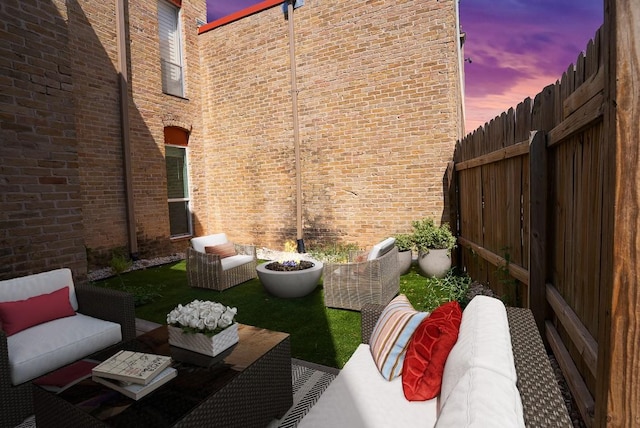 3431 N Hills Dr Unit 112, Austin, TX 78731 - patio terrace at dusk with an outdoor hangout area and a patio