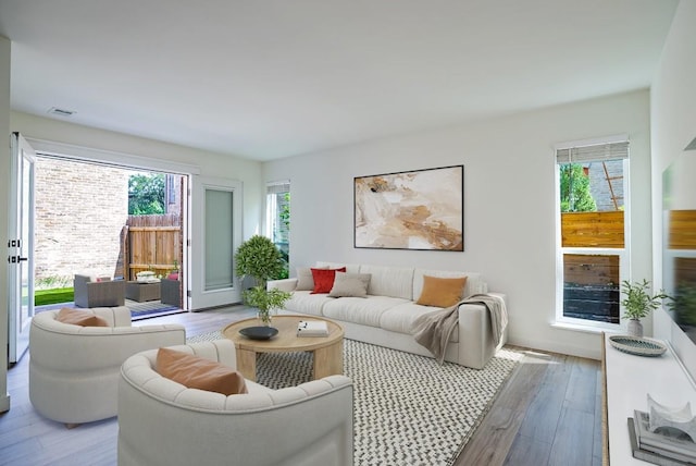 3431 N Hills Dr Unit 112, Austin, TX 78731 - living room with wood finished floors and plenty of natural light