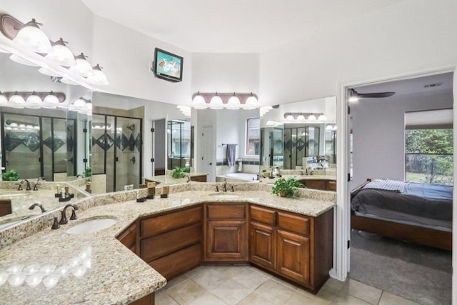 12404 Calistoga Way, Austin, TX 78732 - full bathroom with tile patterned flooring, ensuite bathroom, a shower stall, double vanity, and a bath