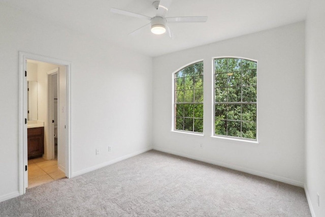 12404 Calistoga Way, Austin, TX 78732 - carpeted spare room with baseboards and ceiling fan