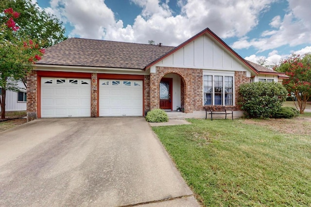 12062 Lincolnshire Dr, Austin, TX 78758 - view of front of home featuring a garage, a front lawn, concrete driveway, brick siding, and roof with shingles