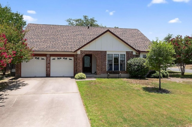 12062 Lincolnshire Dr, Austin, TX 78758 - view of front of property with roof with shingles, an attached garage, a front lawn, and concrete driveway