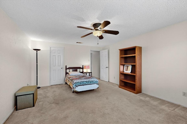 12062 Lincolnshire Dr, Austin, TX 78758 - bedroom featuring carpet flooring, a textured ceiling, and a ceiling fan
