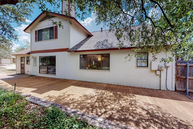 12062 Lincolnshire Dr, Austin, TX 78758 - back of house featuring a shingled roof and a deck