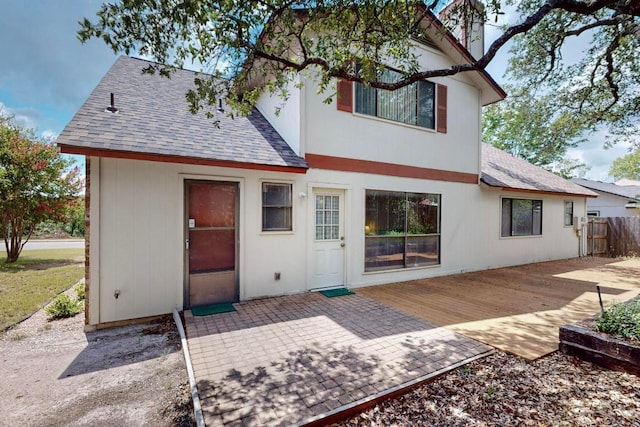 12062 Lincolnshire Dr, Austin, TX 78758 - back of house featuring a shingled roof and a wooden deck