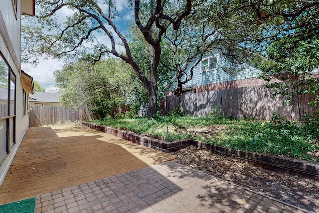 12062 Lincolnshire Dr, Austin, TX 78758 - fenced backyard featuring a wooden deck and a patio area