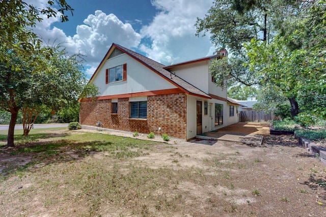 12062 Lincolnshire Dr, Austin, TX 78758 - view of property exterior featuring brick siding
