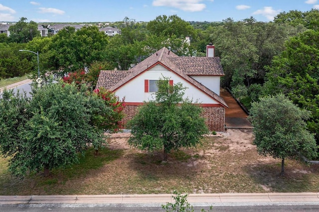 12062 Lincolnshire Dr, Austin, TX 78758 - view of side of property featuring a chimney and stucco siding