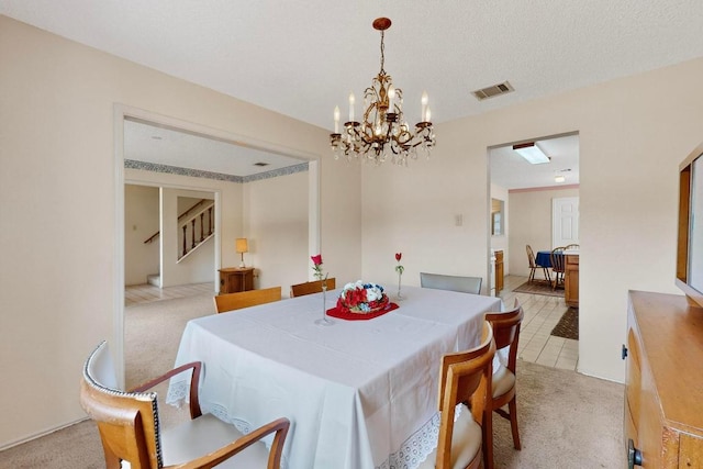 12062 Lincolnshire Dr, Austin, TX 78758 - dining area featuring light colored carpet, stairs, and a chandelier