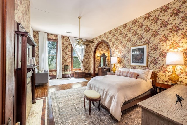 624 Saint Louis St, Gonzales, TX 78629 - bedroom featuring wallpapered walls and wood finished floors