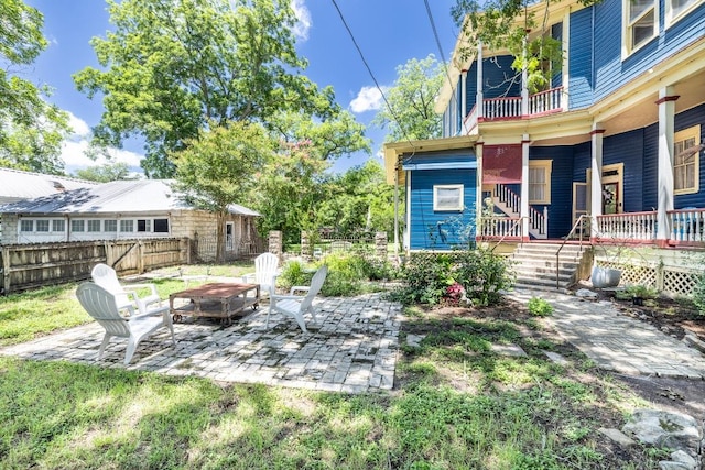 624 Saint Louis St, Gonzales, TX 78629 - view of yard with a balcony, a patio area, and a porch