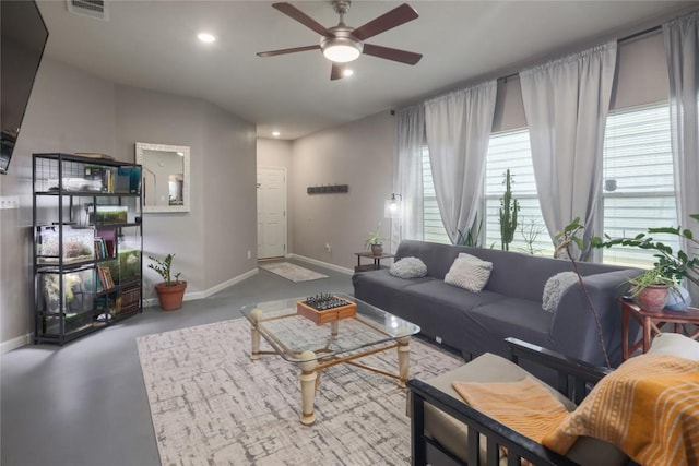 9213 Brents Elm Dr, Austin, TX 78744 - living room with ceiling fan, recessed lighting, and concrete floors