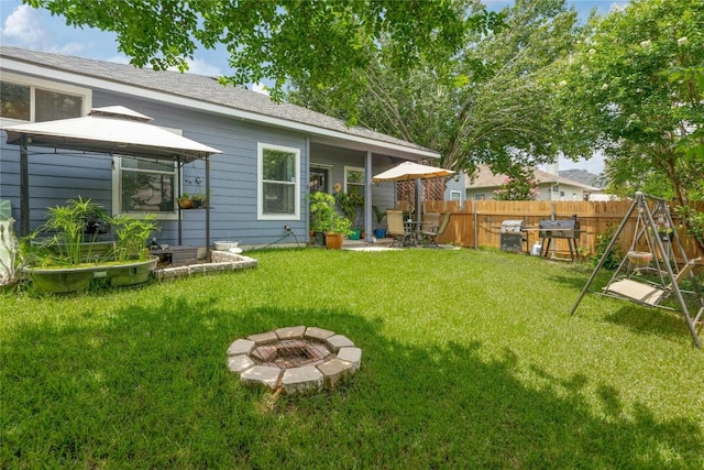 9213 Brents Elm Dr, Austin, TX 78744 - view of yard with a gazebo and a fire pit
