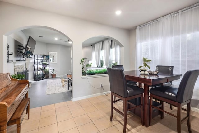 9213 Brents Elm Dr, Austin, TX 78744 - dining area with arched walkways and recessed lighting