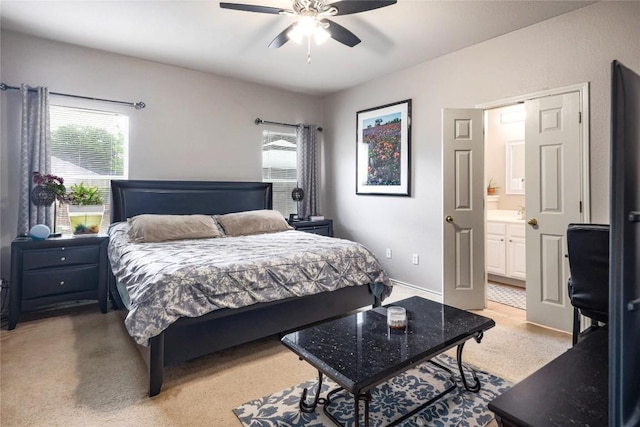 9213 Brents Elm Dr, Austin, TX 78744 - bedroom featuring light colored carpet, ensuite bathroom, and a ceiling fan