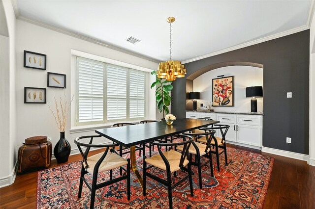 4332 Canoas Dr, Austin, TX 78730 - dining area with dark wood finished floors, a chandelier, and ornamental molding