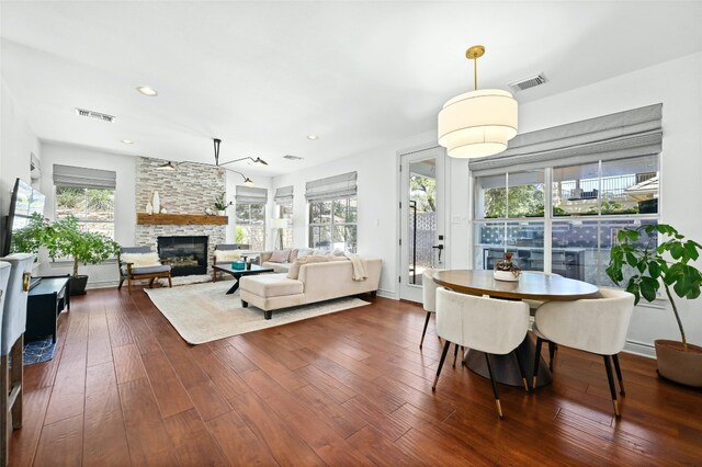 4332 Canoas Dr, Austin, TX 78730 - living room featuring a fireplace, dark wood-style flooring, and recessed lighting