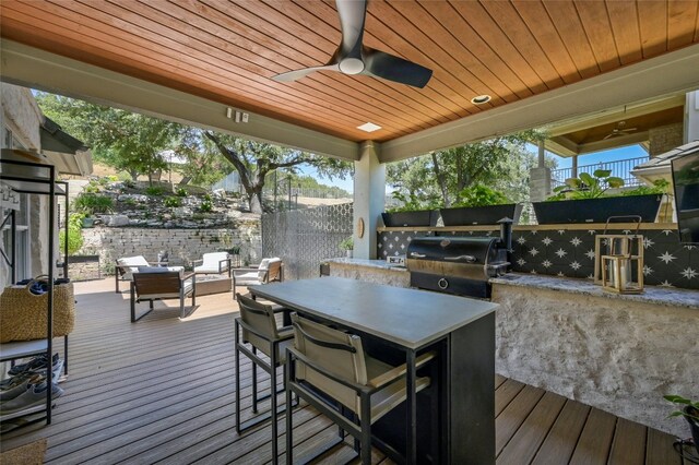 4332 Canoas Dr, Austin, TX 78730 - deck with exterior kitchen, an outdoor living space, and ceiling fan