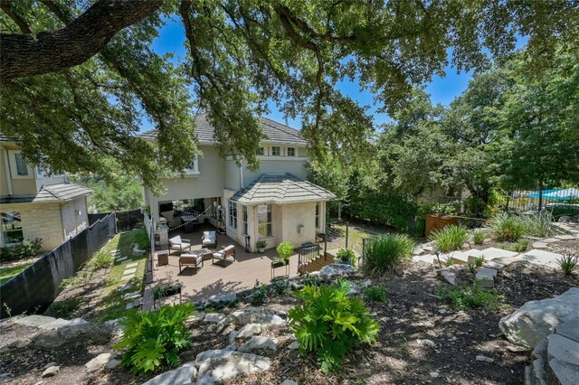 4332 Canoas Dr, Austin, TX 78730 - rear view of property featuring an outdoor hangout area, stucco siding, and a fenced backyard