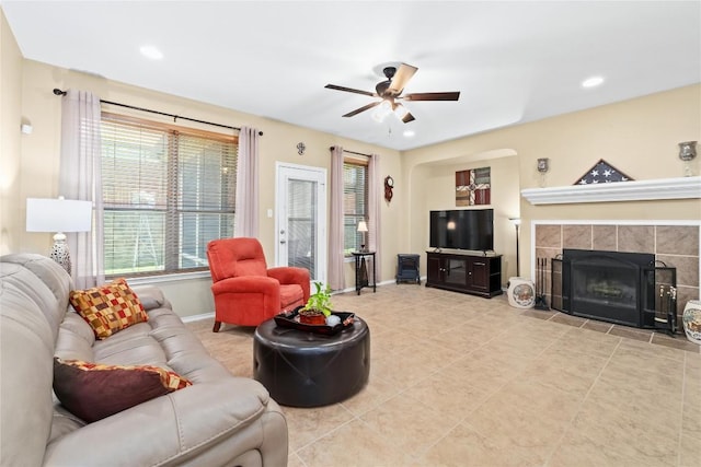 600 Gina Dr, Kyle, TX 78640 - living room featuring a ceiling fan, a fireplace, tile patterned floors, and recessed lighting