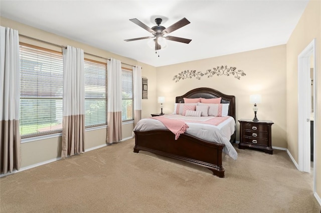 600 Gina Dr, Kyle, TX 78640 - carpeted bedroom with multiple windows and a ceiling fan