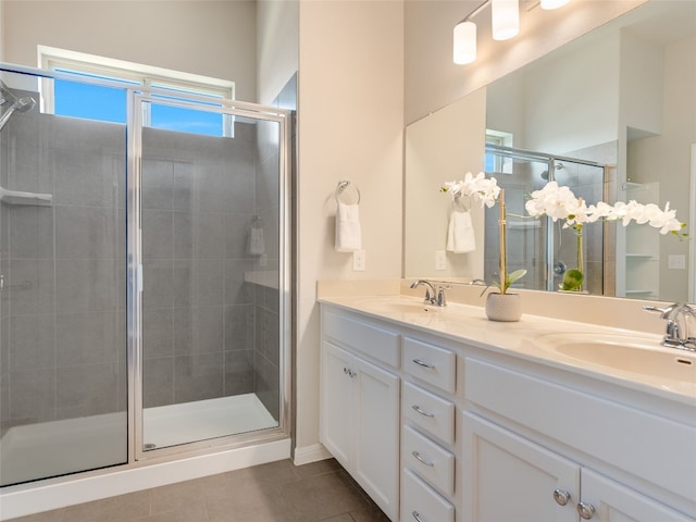 7816 Vista Mejor Dr, Austin, TX 78744 - bathroom with tile patterned floors, a shower stall, and double vanity