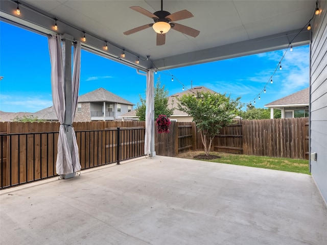 7816 Vista Mejor Dr, Austin, TX 78744 - fenced backyard featuring a ceiling fan and a patio area