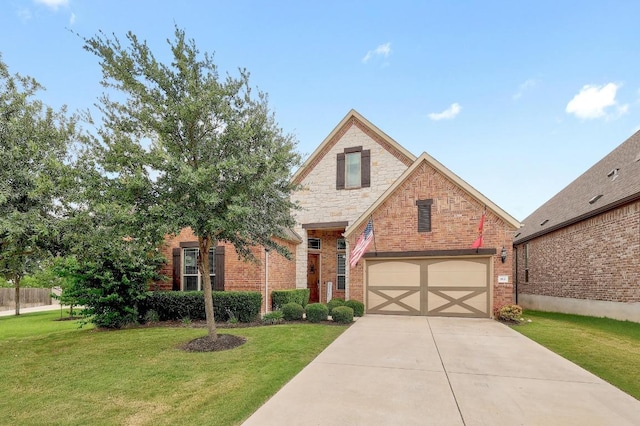 812 Anahuac Dr, Leander, TX 78641 - view of front of property featuring a front lawn, driveway, brick siding, and an attached garage