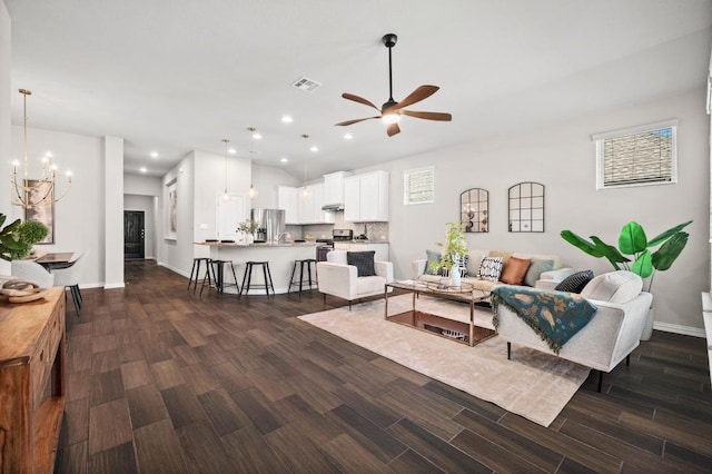 2205 Bonavista Way, Leander, TX 78641 - living room with a chandelier, ceiling fan, dark wood-style flooring, and recessed lighting