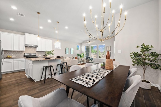 2205 Bonavista Way, Leander, TX 78641 - dining space featuring recessed lighting, dark wood-style flooring, and a chandelier
