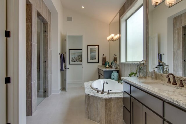 4106 Paleleaf Path, Bee Cave, TX 78738 - bathroom featuring vaulted ceiling, two vanities, a stall shower, a garden tub, and tile patterned floors