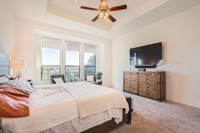 4106 Paleleaf Path, Bee Cave, TX 78738 - carpeted bedroom featuring a tray ceiling and a ceiling fan