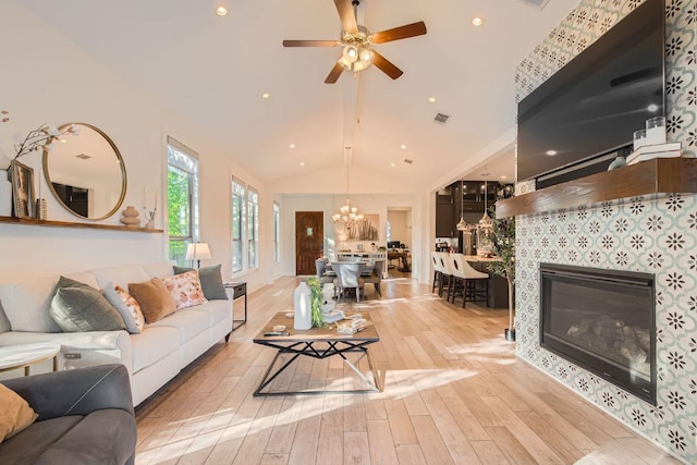 4106 Paleleaf Path, Bee Cave, TX 78738 - living area featuring a chandelier, wood finished floors, a ceiling fan, a fireplace, and recessed lighting