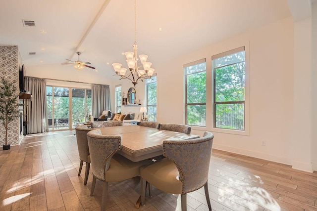 4106 Paleleaf Path, Bee Cave, TX 78738 - dining area with light wood-style floors, a chandelier, and lofted ceiling