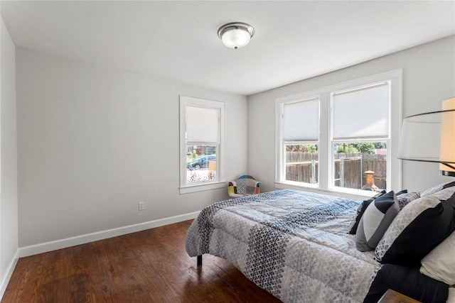 1208 Cedar Ave, Austin, TX 78702 - bedroom with multiple windows and wood finished floors