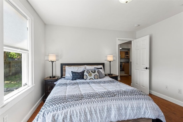 1208 Cedar Ave, Austin, TX 78702 - bedroom with dark wood-type flooring and baseboards