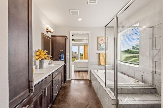 8054 Stone Mountain Trl, San Marcos, TX 78666 - ensuite bathroom featuring a ceiling fan, double vanity, and a bath