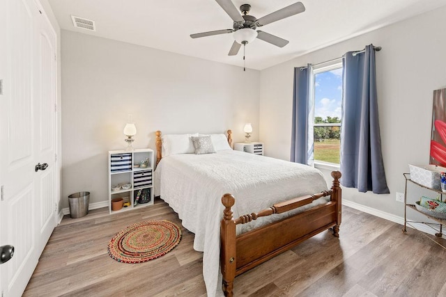 8054 Stone Mountain Trl, San Marcos, TX 78666 - bedroom featuring wood finished floors and ceiling fan