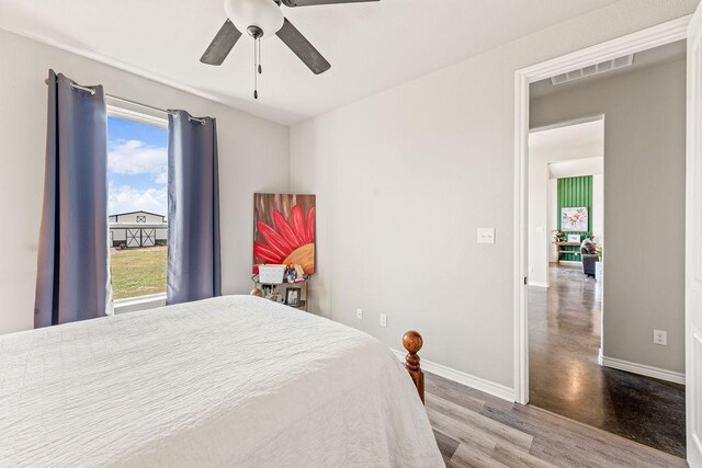 8054 Stone Mountain Trl, San Marcos, TX 78666 - bedroom with wood finished floors and ceiling fan
