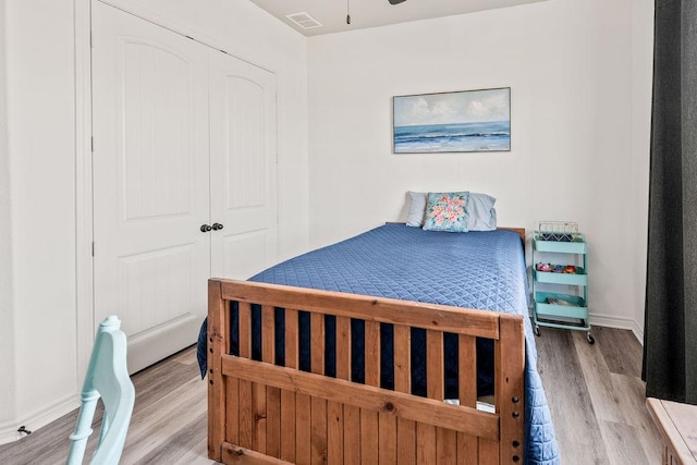8054 Stone Mountain Trl, San Marcos, TX 78666 - bedroom featuring wood finished floors and a closet