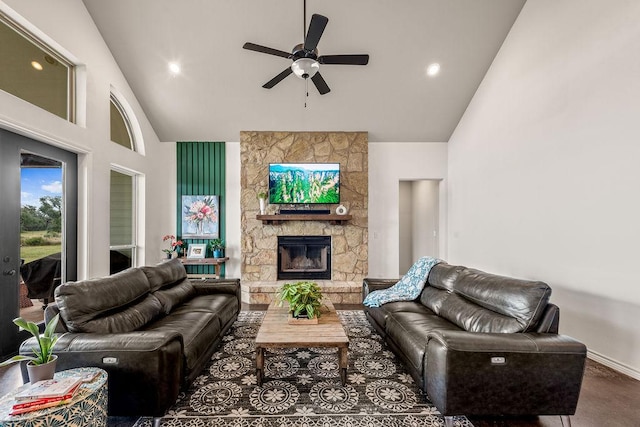 8054 Stone Mountain Trl, San Marcos, TX 78666 - living room featuring high vaulted ceiling, a ceiling fan, a stone fireplace, and recessed lighting